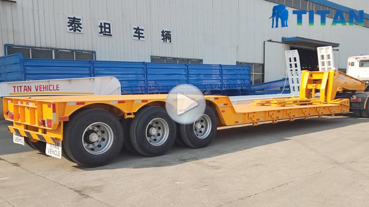 Description of removable gooseneck trailer: The removable gooseneck trailer for sale near me uses a concave beam type. Removable gooseneck trailer can separate the gooseneck from the trailer, and achieve contact between the front end of the vehicle and the ground. After the cargo or equipment is loaded, the removable gooseneck trailer is restored to the original transportation state in time for transportation.  To meet your transport needs and your local regulations, we can customize different configuration 3 axle removable gooseneck trailer for you.  3 Axle 60 Ton Removable Gooseneck Trailer for Sale Near Me  3 Axle 60 Ton Removable Gooseneck Trailer for Sale Near Me  3 Axle 60 Ton Removable Gooseneck Trailer for Sale Near Me  3 Axle 60 Ton Removable Gooseneck Trailer for Sale Near Me  3 Axle 60 Ton Removable Gooseneck Trailer for Sale Near Me  Front Loading Ramp of 3 Axle 60 Ton Removable Gooseneck Trailer  3 Axle 60 Ton Removable Gooseneck Trailer for Sale Near Me  Platform of 3 Axle 60 Ton Removable Gooseneck Trailer Near Me  3 Axle 60 Ton Removable Gooseneck Trailer for Sale Near Me  Axle and Spring Leaf of 3 Axle Removable Gooseneck Trailer    Specification of removable gooseneck trailer: Overall dimension: 16000mm*3000mm *2500mm  Loading capacity(T): 60 ton  Axle: 3 axle  Tire: 12 units  Suspension: Mechanical suspension  Hydraulic cylinder: 12KW diesel engine with hydraulic station    Video of 3 axle removable gooseneck trailer: